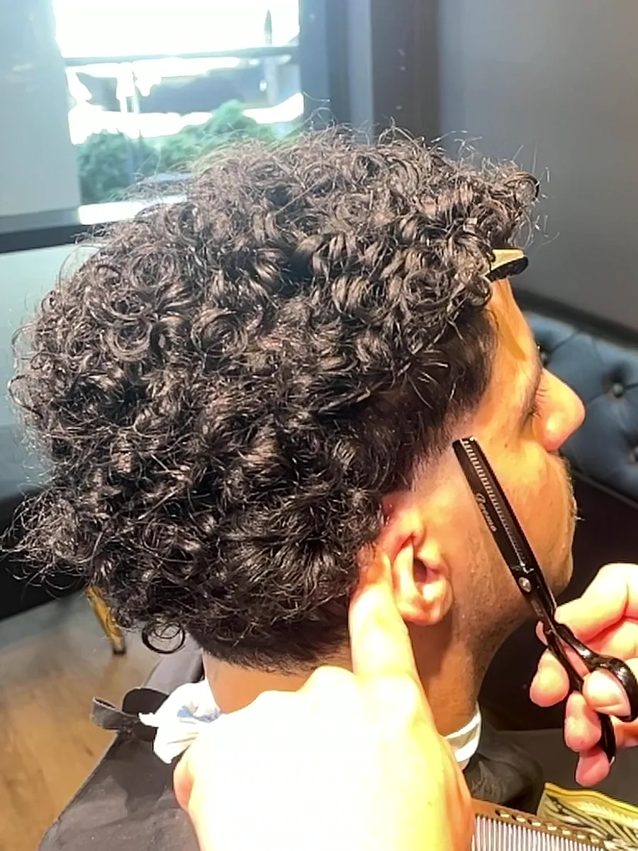 Scissor work through a curly top